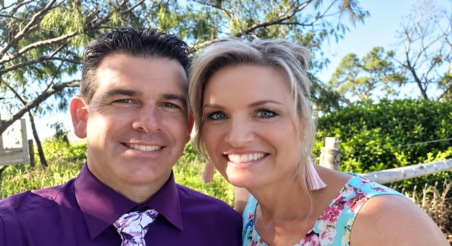 Dean and Vanita, the husband-and-wife team behind Carlton Pest Control, smiling together outdoors